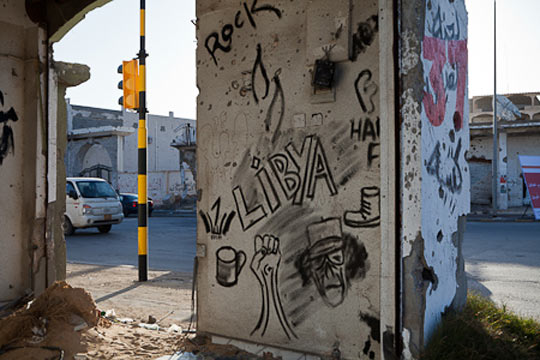 //Scribbles on a destroyed house on Misrata’s Tripoli Street, where fighting was heavy for several months.