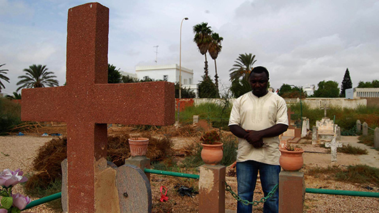 //Father Jonathan in a moment of silence. (Photo by Sana Sbouai).