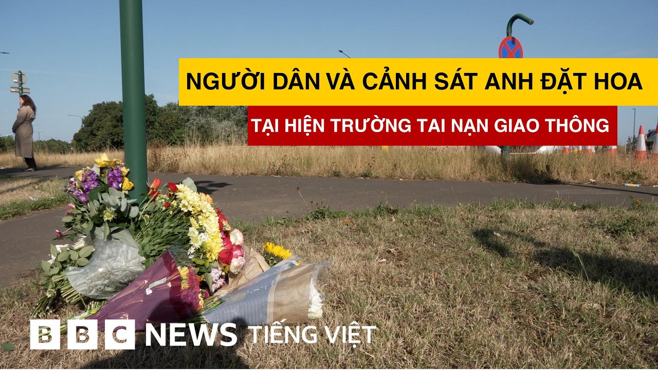 NGƯỜI DÂN VÀ CẢNH SÁT ANH ĐẶT HOA TẠI HIỆN TRƯỜNG TAI NẠN GIAO THÔNG